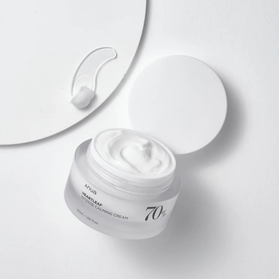 Anua moisturizer jar open showing white cream best calming cream for redness on white background