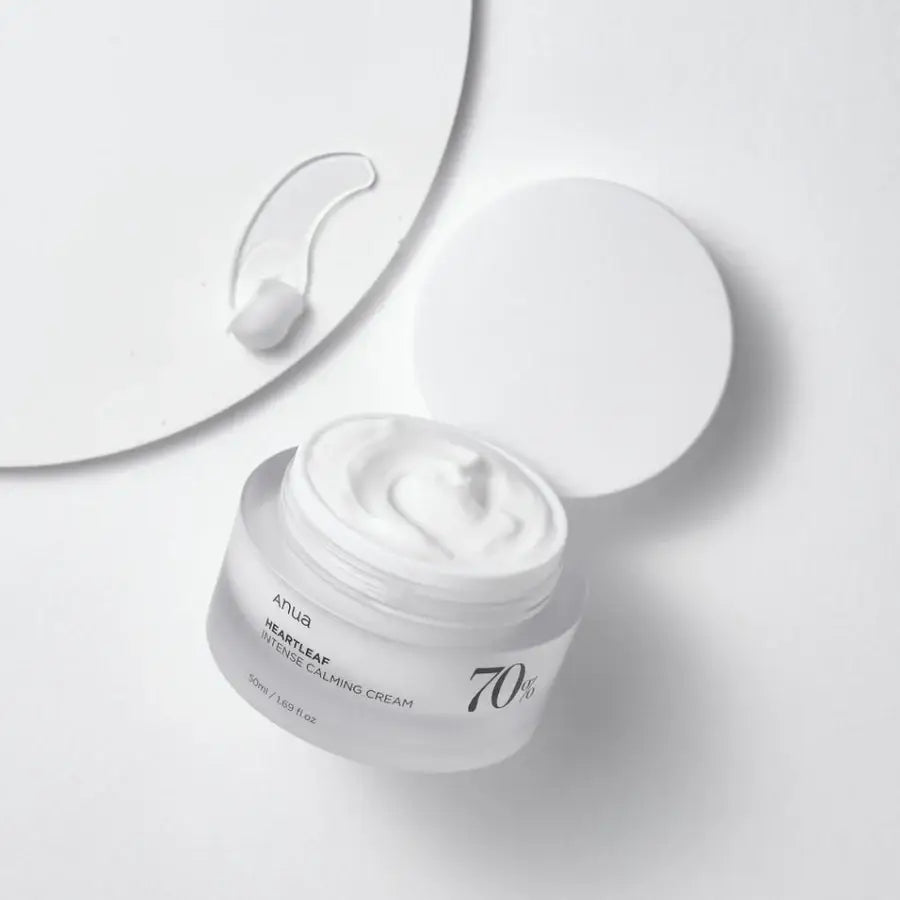 Anua moisturizer jar open showing white cream best calming cream for redness on white background
