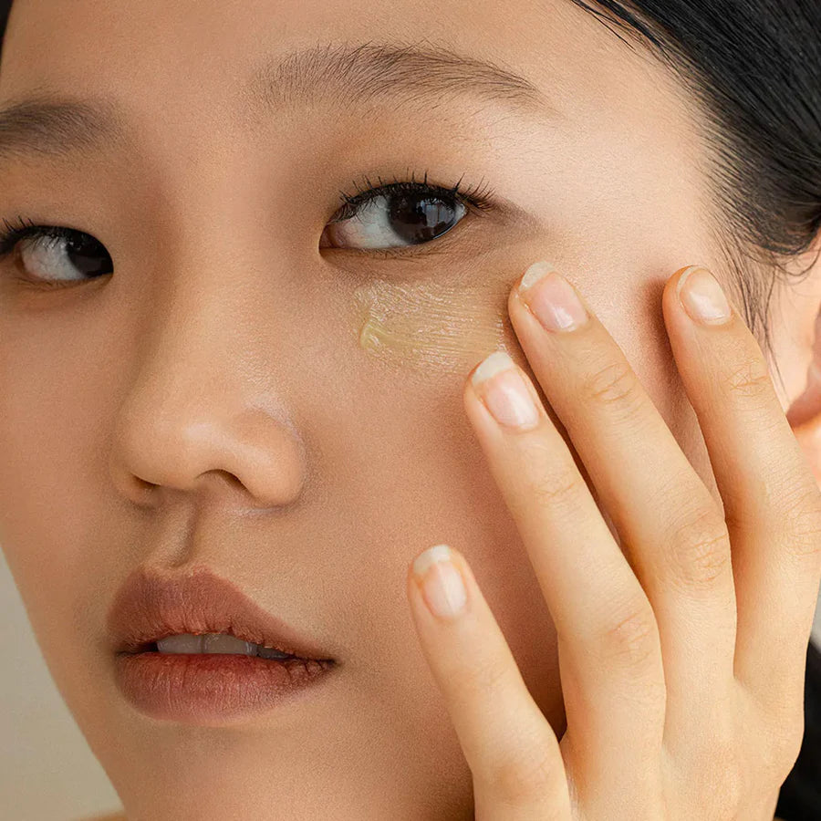 Beauty Of Joseon retinal eye cream for wrinkles applied gently under eye on woman’s face