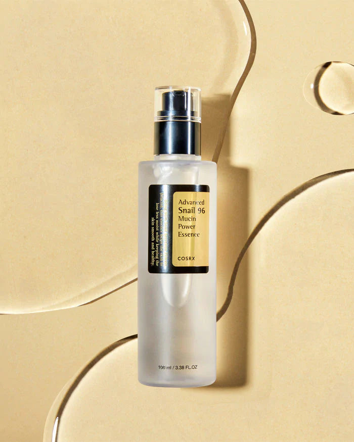 Cosrx toner bottle labeled Advanced Snail 96 Mucin Power Essence snail mucin essence for face on beige background