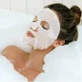 Woman relaxing with esfolio Korean ampoule mask for hydration during a soothing bath