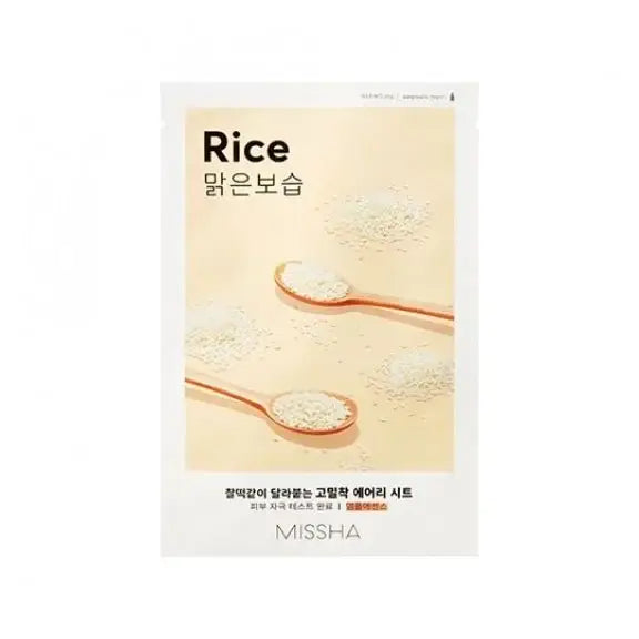 MISSHA brightening rice facial mask sheet with rice grains and wooden spoons on beige background