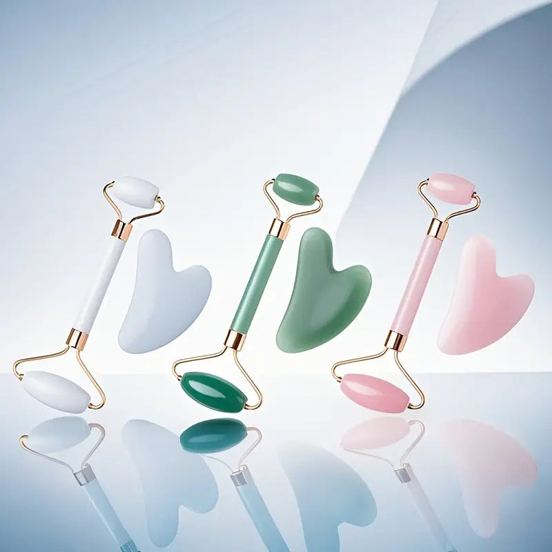 Zuzu Aura skincare tools for glowing skin featuring white, green, and pink jade rollers with matching gua sha stones