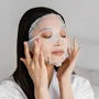 Some By Mi dermatologist tested hydrating face mask sheet applied on woman’s face
