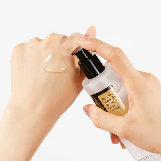 Cosrx toner with snail mucin essence for face being applied on the back of a hand