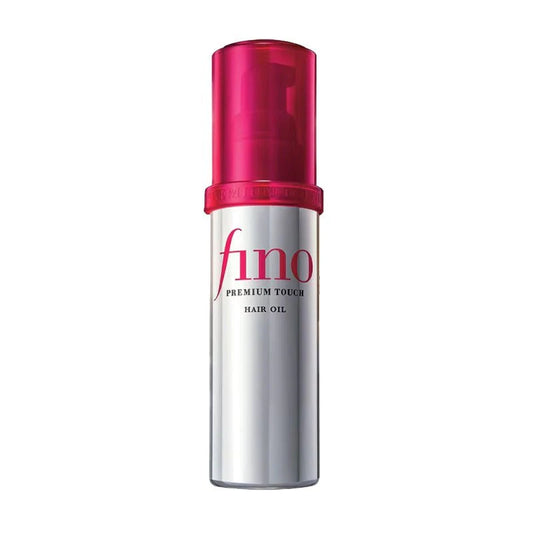Shiseido Fino Premium Touch hair oil in silver bottle with pink pump for smooth hair care