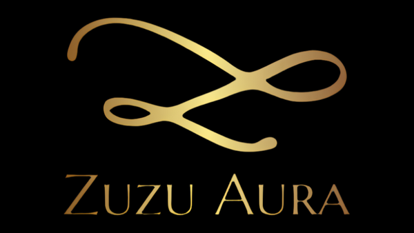 Zuzu Aura logo in elegant gold script on black background for skincare gift card