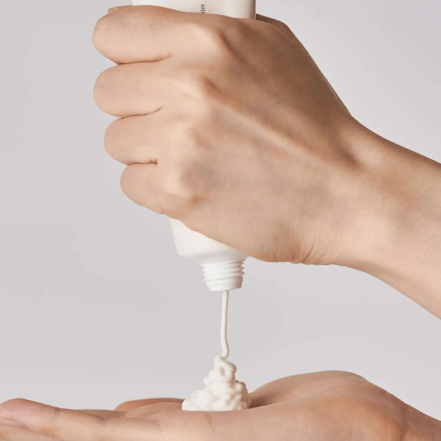 Beauty Of Joseon broad spectrum SPF 50 sunscreen being applied to a hand