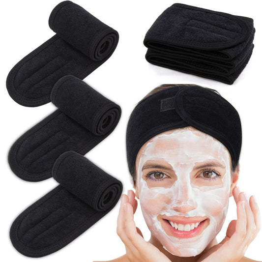 Washable spa headband for face routine by Zuzu Aura in black, shown worn with facial mask and multiple folded headbands